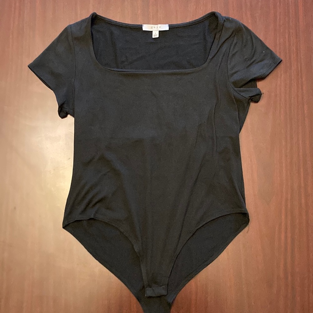 Gaze, large, black short sleeve square neck body suit.